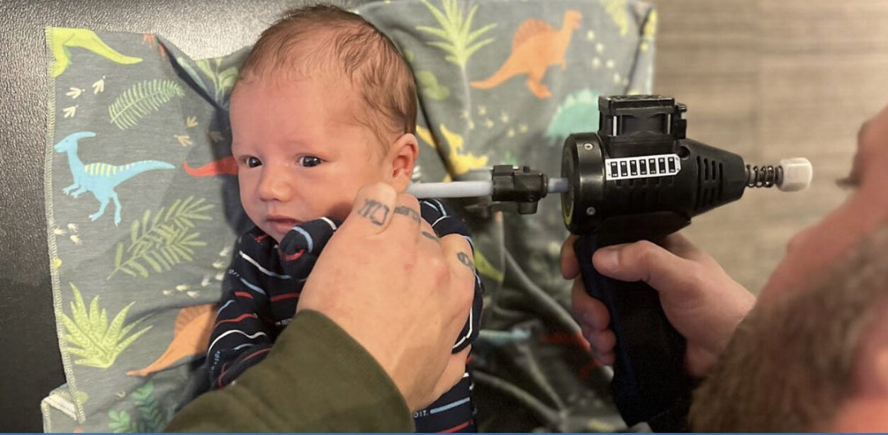 baby being adjusted by machine